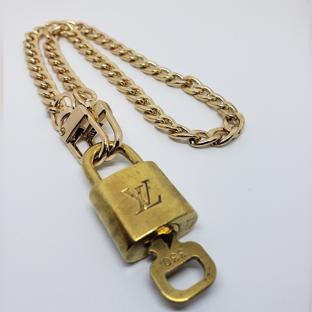 #330 Authentic Louis Vuitton Lock And Key Set With Unbranded Chain